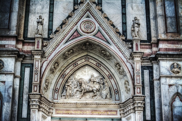 Detail of Santa Croce cathedral facade in Florence Italy