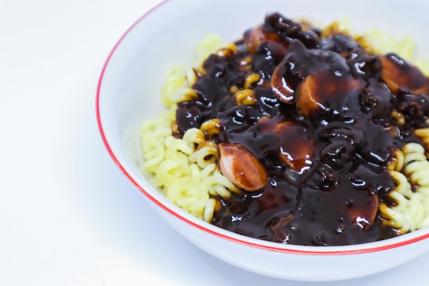 A Detail Shot of Tasty Korean Noodle Named Jjajangmyeon with Lot of Sausages as A Topping