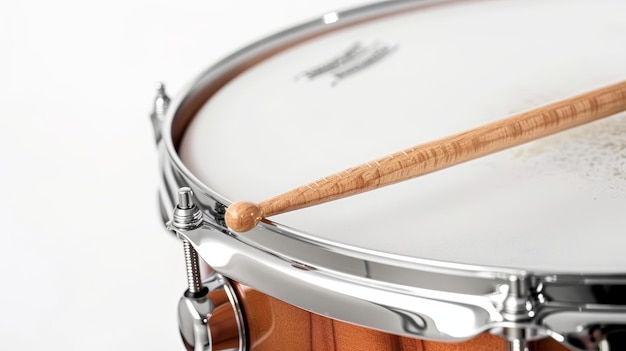 Detail of a snare drum with a drumstick striking capturing the impact