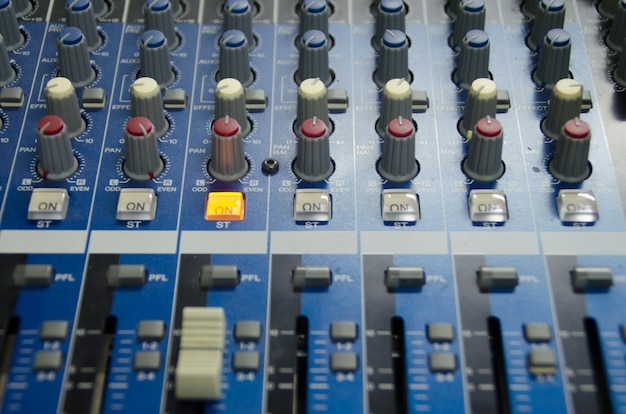 detail sound mixer in red and white light with great perspective