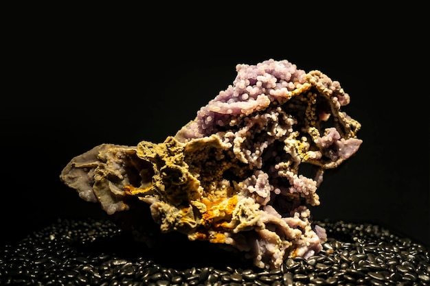 A detailed closeup of a beautiful cluster of glassy quartz crystal mineral stones