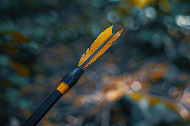 Photo detailed image of a yellow arrow on a stick suitable for directional concepts