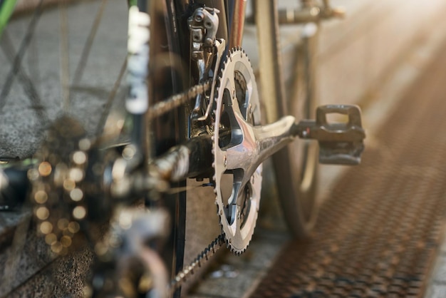 Detailed view of bicycle mechanisms sprocket pedal and chain on a mountain bike