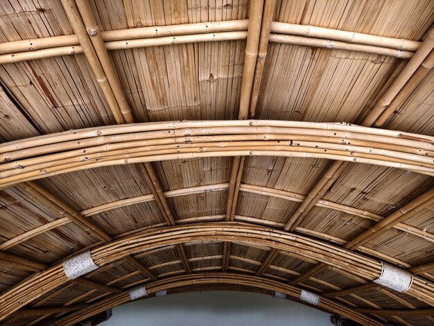 A detailed view of a wooden bamboo ceiling with perforations