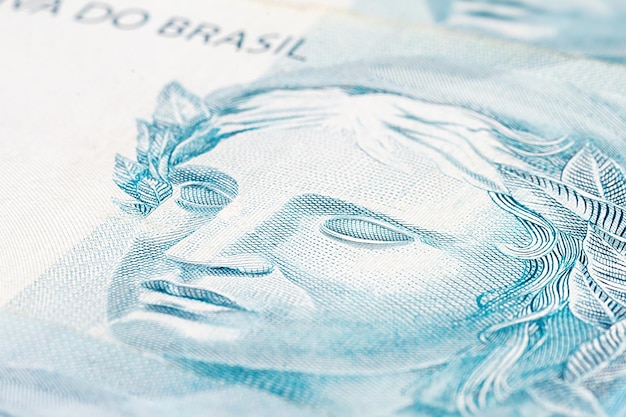 details of 100 reais banknote from brazil with selective focus background image for monetary concept Financial crisis or financial business in brazil