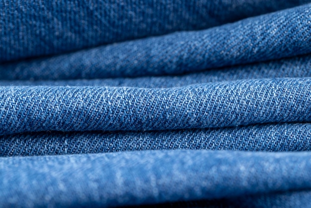 details of a blue denim fabric made of natural cotton a closeup of a piece of blue denim