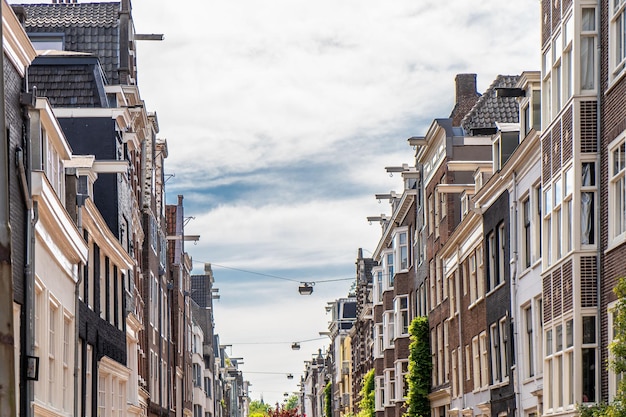 Details and facades of Amsterdam characteristic brick construction of residential building in Amsterdam School style High quality photo