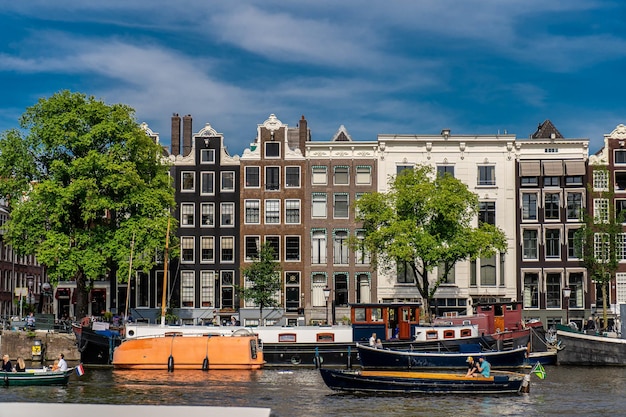 Details and facades of Amsterdam characteristic brick construction of residential building in Amsterdam School style High quality photo