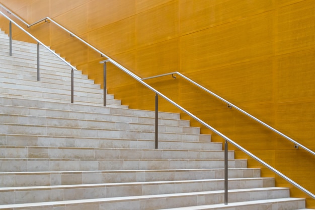 Details of metal railing and marble stairs of modern building