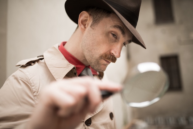 Detective using a magnifying glass