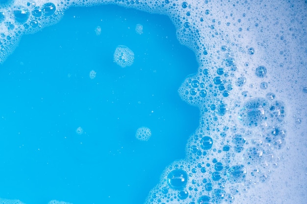 Detergent foam bubble on blue background