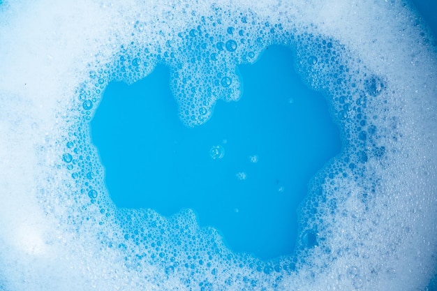 Detergent foam bubble blue background