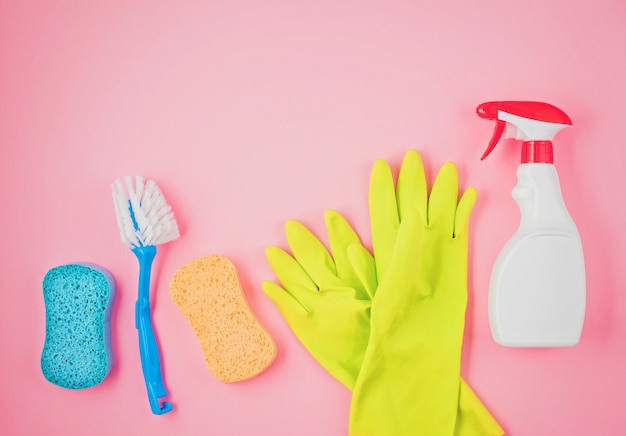 Detergents and cleaning accessories in pastel color.