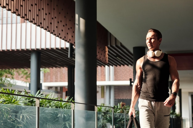 Determined Sportsman Walking to Gym