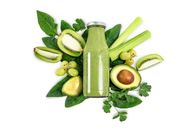 Detox cleanse drink concept green vegetable smoothie ingredients Natural organic healthy juice in bottle for weight loss diet or fasting day Cucumber apple lime and spinach mix isolated on white