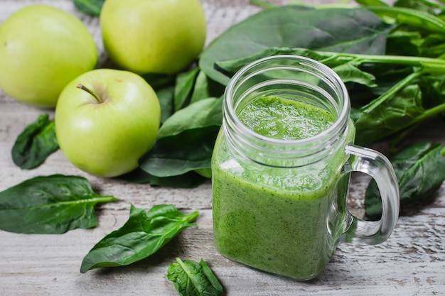 Detox concept. Spinach smoothie in mason jar. Healthy Raw Vegetarian Smoothie 