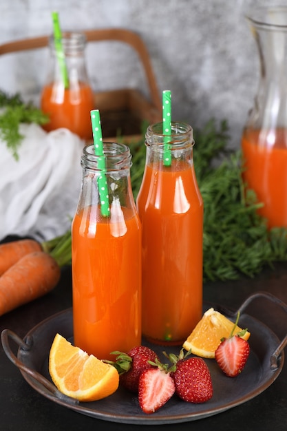 Detox drink. Freshly made Carrot Strawberry Orange Juice. For those who monitor their health