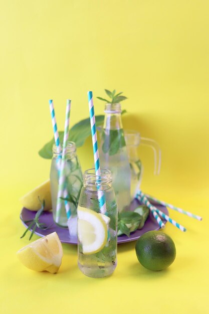 Detox water from citruses mint leaves tarragon and cucumber slices in glasses