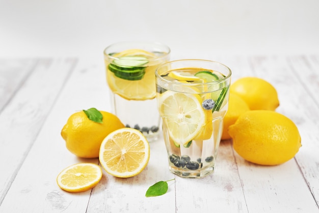 Detox water with sliced lemon, cucumber and blueberries