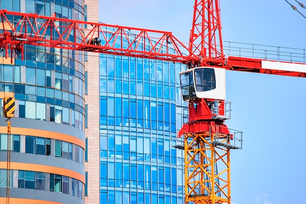 Development of modern office building with the lifting crane in the business district