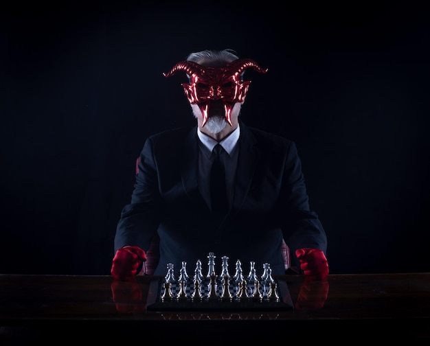 the devil plays chess, black studio background