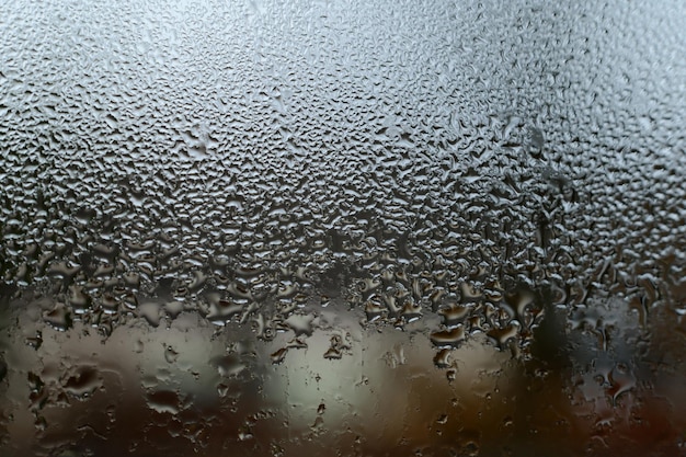 Dew drops and condensation on glass cold season and high humidity on windows in houses