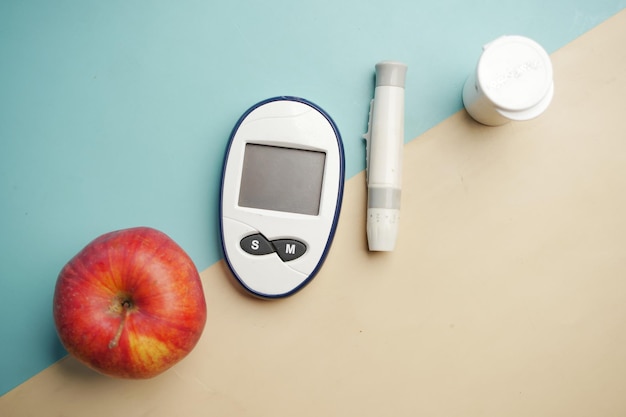 Diabetic measurement tools apple on table