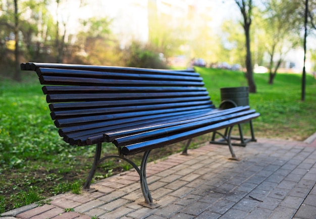 Diagonal park bench bokeh background with light leak