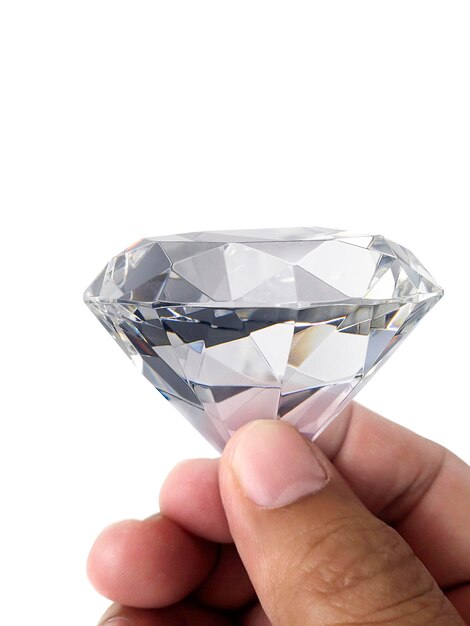 Photo diamond jewel in hand isolated on white background