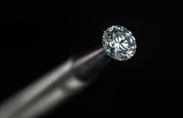 Diamond in Jewelry Tweezers close up