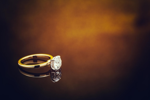 Diamond Ring on Golden Light Bokeh Background