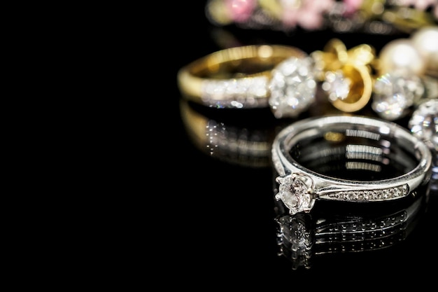 diamond rings on black surface