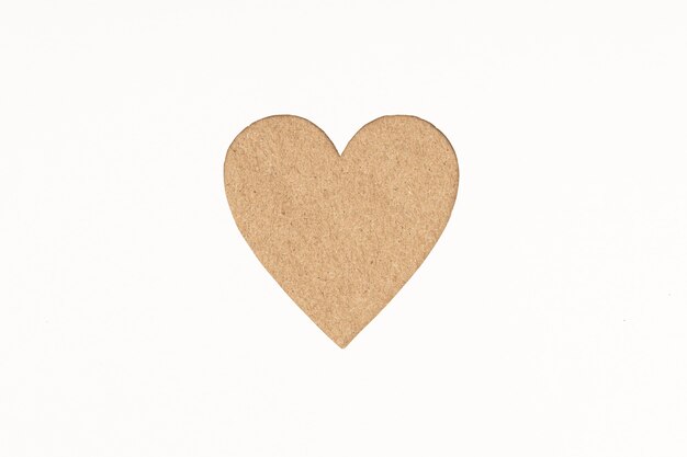 Photo die-cut cardboard heart shaped isolated on white paper background. love concept