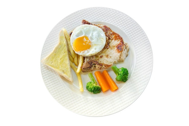 Die cut of meat Steak with french fries fried eggs toast on white plate on white isolated