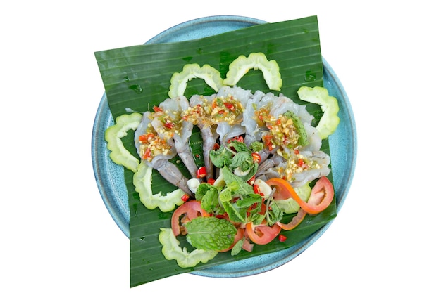 Die cut of shrimp in fish sauce on banana leaf on white isolated