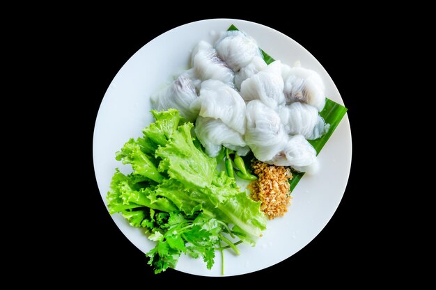 Die cut of Thai Steamed Pork Dumplings on black isolated