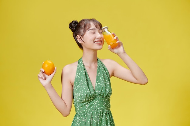 Diet Healthy Eating Young woman drinking fresh orange juice Concept Care figure