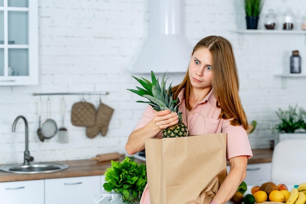 Diet healthy food on pretty female hands Attractive woman on the kitchen