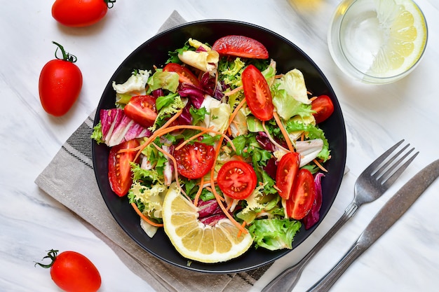 diet lunch fresh vegetables salad from tomato, spinach, lettuce, onion and paprika