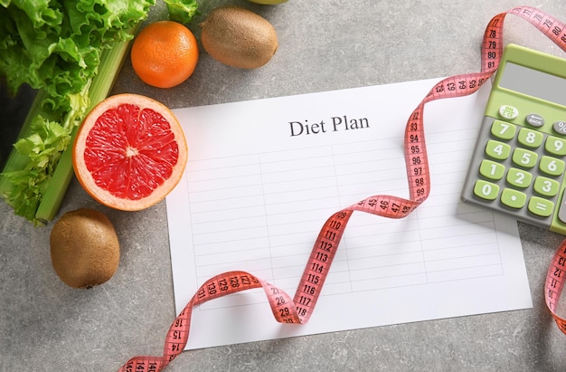 Diet plan and healthy foods on light background