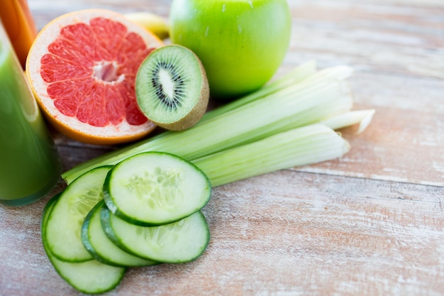 diet, vegetable food, healthy eating and objects concept - close up of ripe fruits and vegetables on table