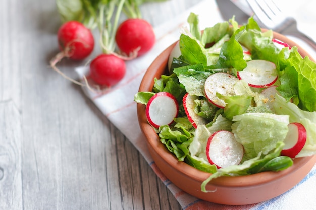 Dietary food for fitness. Radish, Lettuce and Arugula Salad