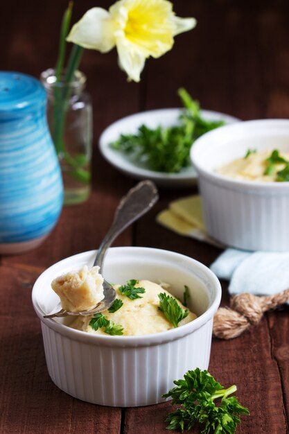 Dietary souffle of minced meat with parsley on a dark background.