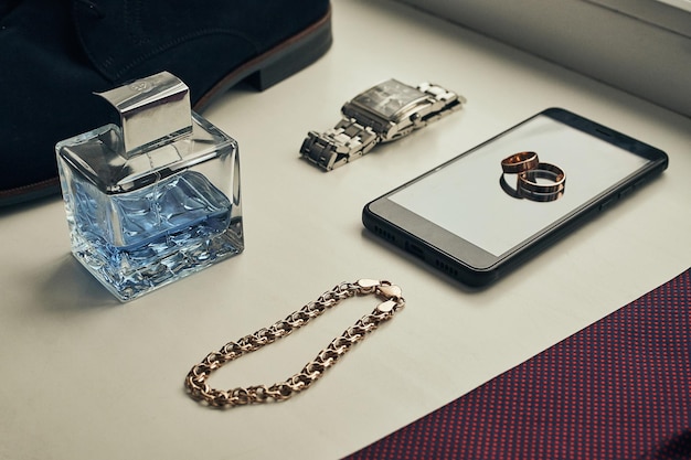 Different accessories of a businessman for creating a style of a people lie on a wooden background