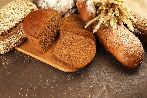 Different bread with ears on wooden table