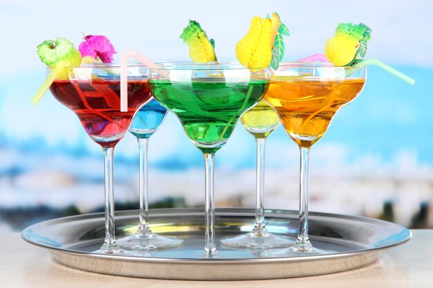 Photo different cocktails on bright background