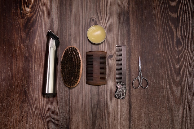 Different combs, brush and other tools for grooming a beard. Close up view.