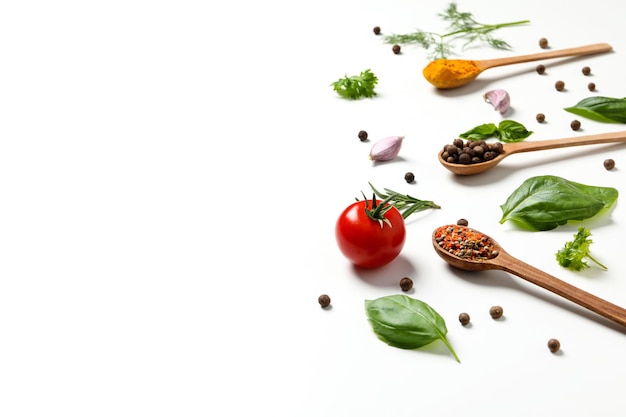 Different cooking ingredients and spices on white background