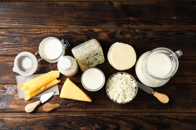 Different dairy products on wooden background