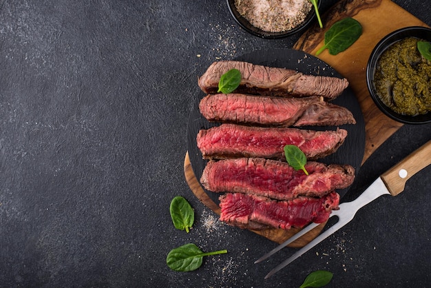 Different degrees of steak roasting steak with blood medium to high roast steak on a wooden board